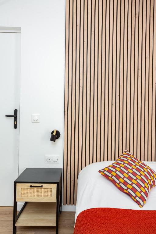 Postel nebo postele na pokoji v ubytování Maison Geranium