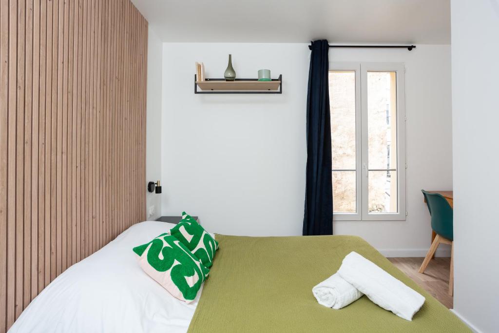 Postel nebo postele na pokoji v ubytování Maison Geranium