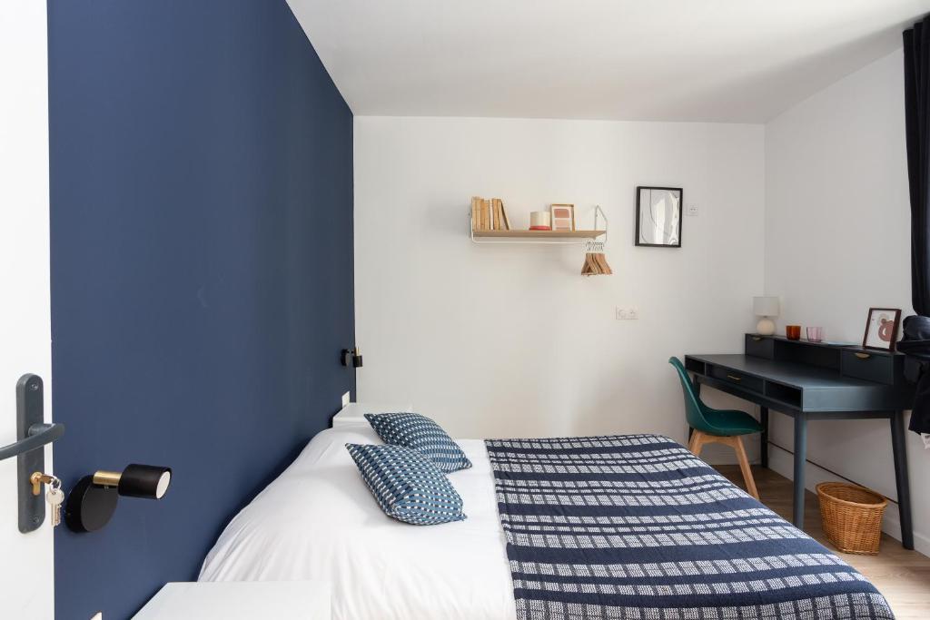 Postel nebo postele na pokoji v ubytování Maison Geranium