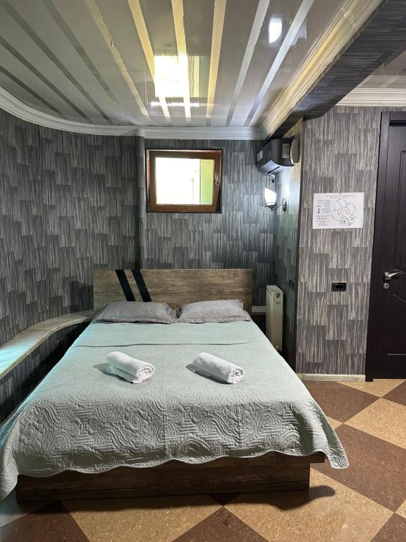 Postel nebo postele na pokoji v ubytování Hotel Piza