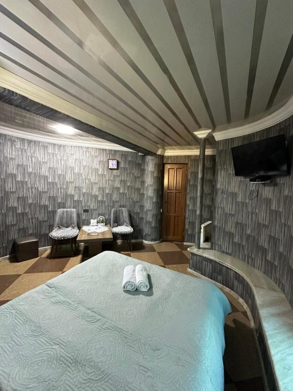 Postel nebo postele na pokoji v ubytování Hotel Piza