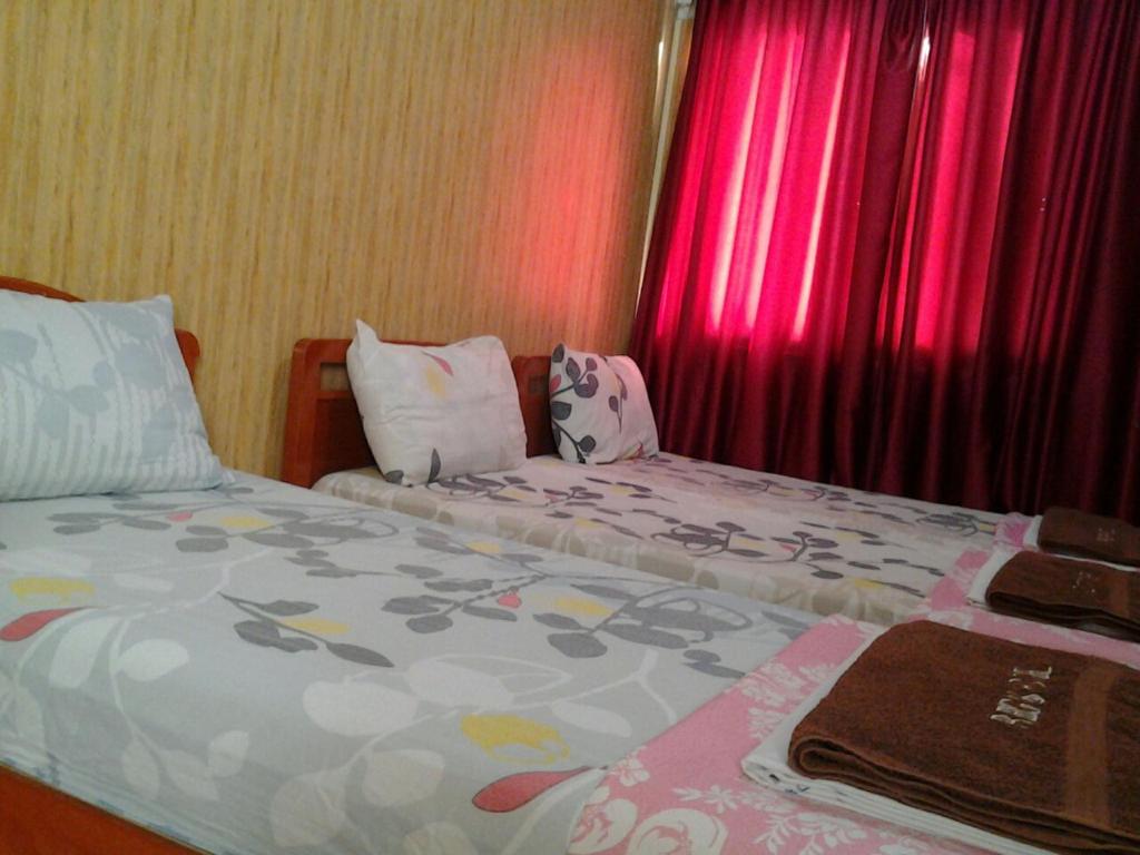Postel nebo postele na pokoji v ubytování Regis Hotel