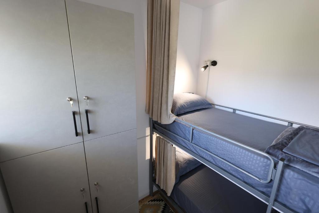 Letto o letti in una camera di Baza Hostel - Swimming Pool