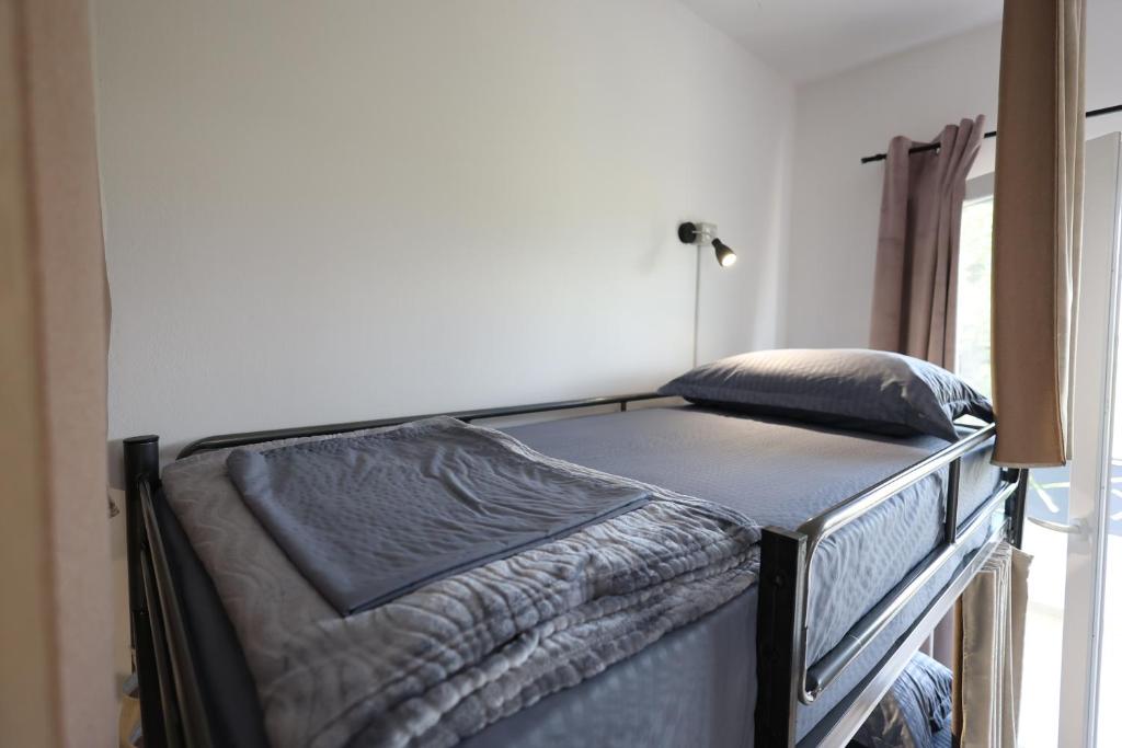 Letto o letti in una camera di Baza Hostel - Swimming Pool