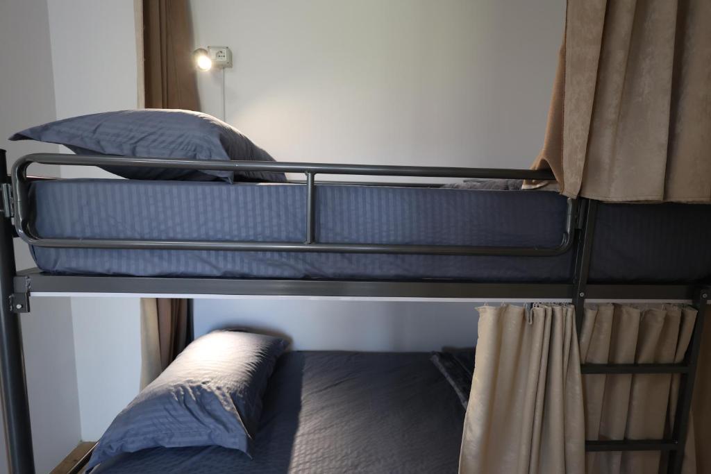 Letto o letti in una camera di Baza Hostel - Swimming Pool