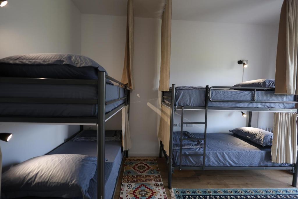 Letto o letti in una camera di Baza Hostel - Swimming Pool