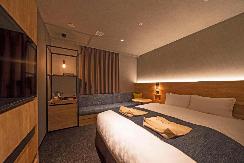 Postel nebo postele na pokoji v ubytování hotel around TAKAYAMA, Ascend Hotel Collection