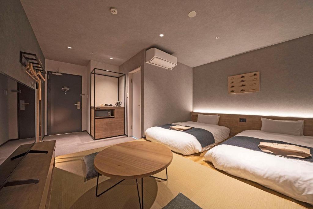 Postel nebo postele na pokoji v ubytování hotel around TAKAYAMA, Ascend Hotel Collection