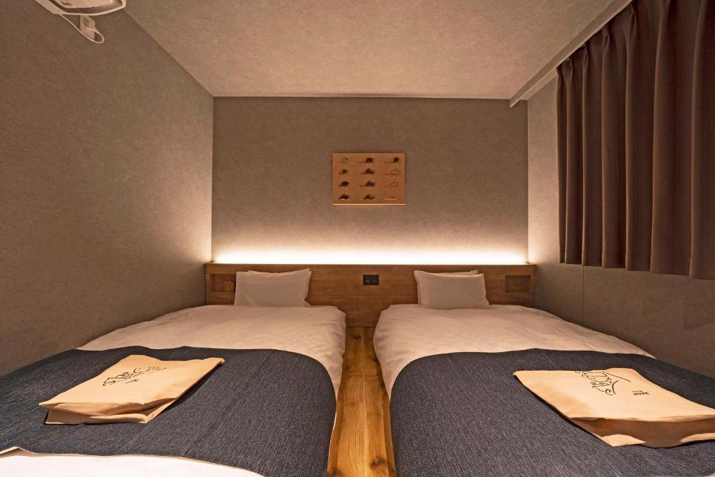 Postel nebo postele na pokoji v ubytování hotel around TAKAYAMA, Ascend Hotel Collection