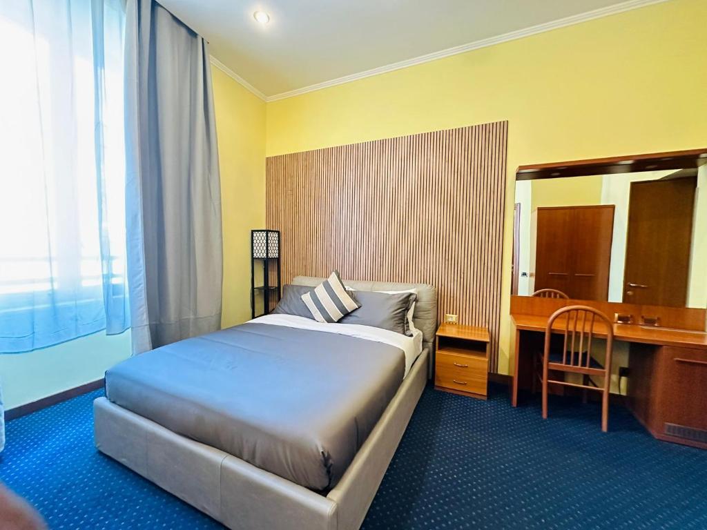 Postel nebo postele na pokoji v ubytování Hotel Rome place