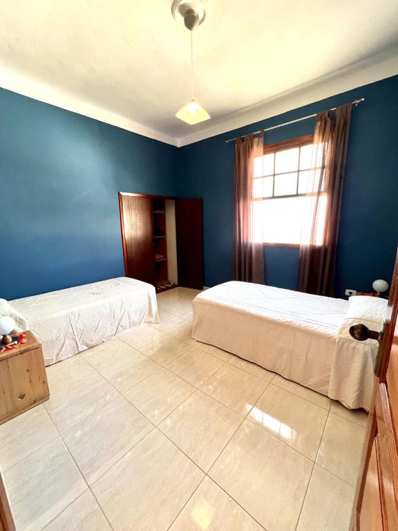 Postel nebo postele na pokoji v ubytování CHC - Apartamento Los Topetes