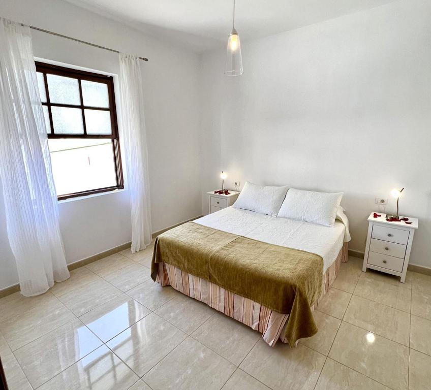 Postel nebo postele na pokoji v ubytování CHC - Apartamento Los Topetes
