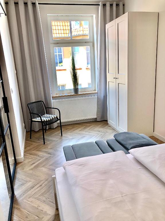 Posteľ alebo postele v izbe v ubytovaní Apartamenty "CENTRUM" Mrągowo Mazury