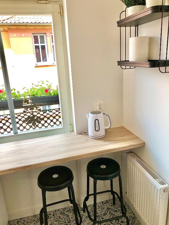 Príslušenstvo na prípravu kávy alebo čaju v ubytovaní Apartamenty "CENTRUM" Mrągowo Mazury