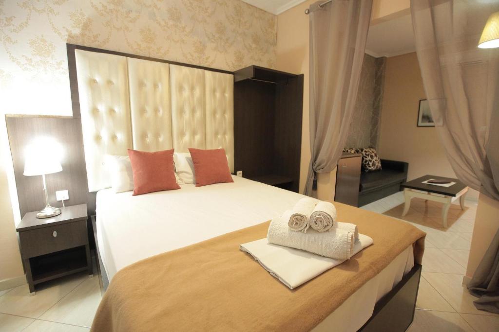 Postel nebo postele na pokoji v ubytování Hotel Epavli