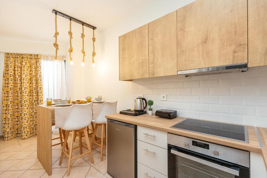 Kuchyň nebo kuchyňský kout v ubytování Koukos Loft Apartments
