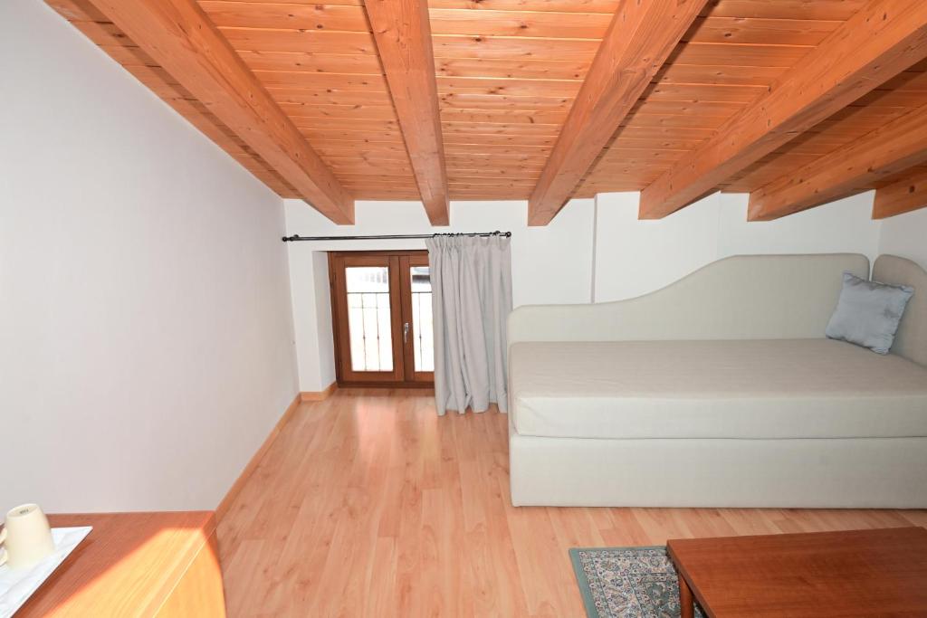 Postel nebo postele na pokoji v ubytování Hotel La Fenice e Sole