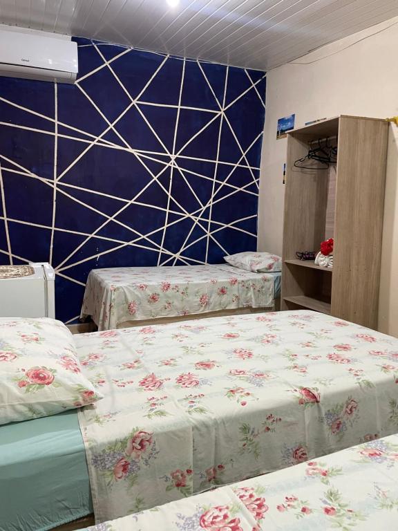 Postel nebo postele na pokoji v ubytování Estação Noronha