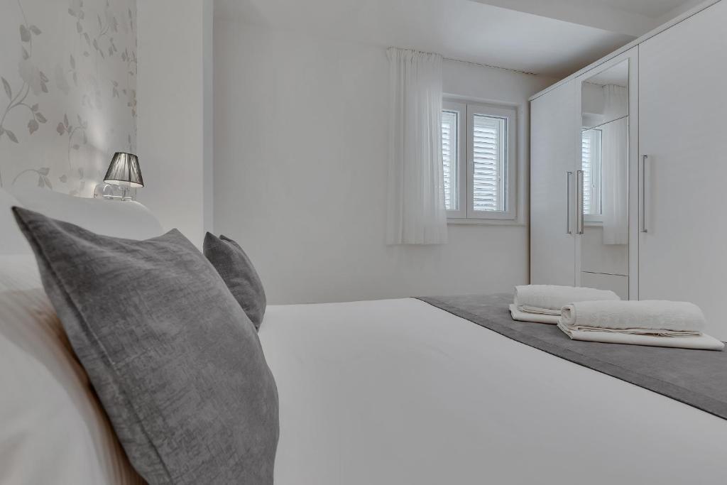 Postel nebo postele na pokoji v ubytování Apartments Dany