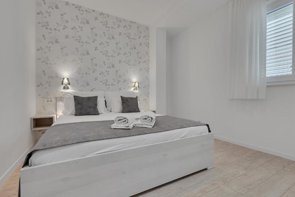 Postel nebo postele na pokoji v ubytování Apartments Dany