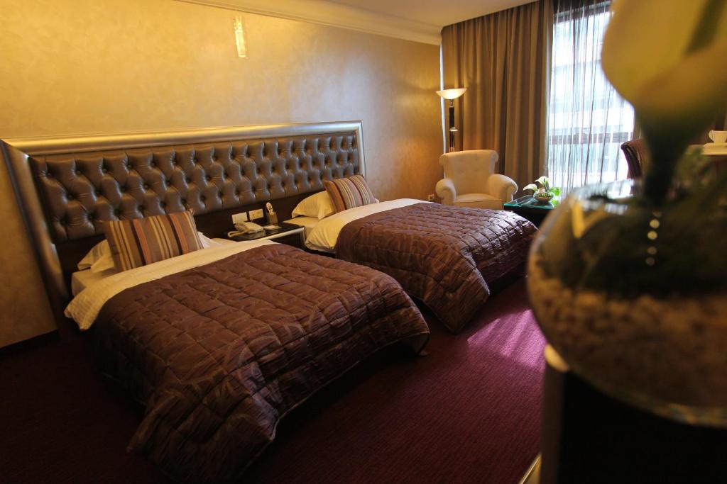 Postel nebo postele na pokoji v ubytování Elite Hotel By Beverly