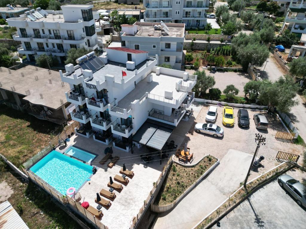 an aerial view of a white house with a swimming pool at Noa Boutique Hotel in Ksamil