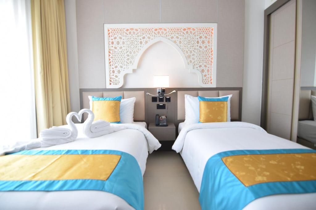 Postel nebo postele na pokoji v ubytování Central Inn Souq Waqif