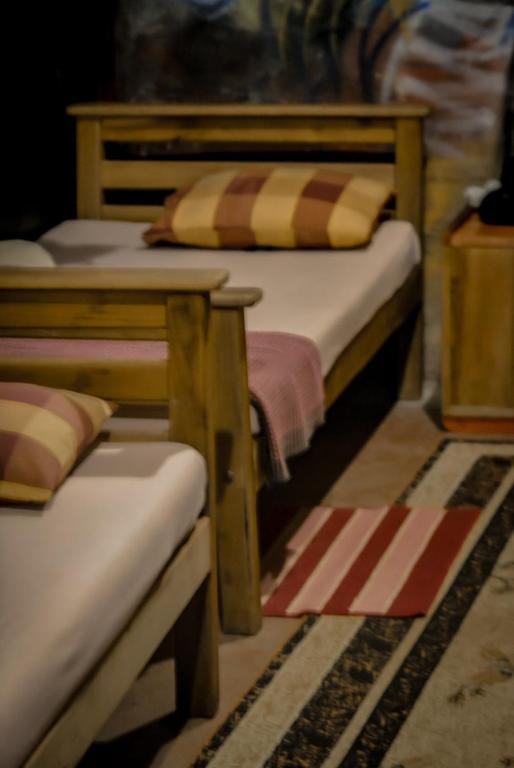 Postel nebo postele na pokoji v ubytování Hostal Tree House