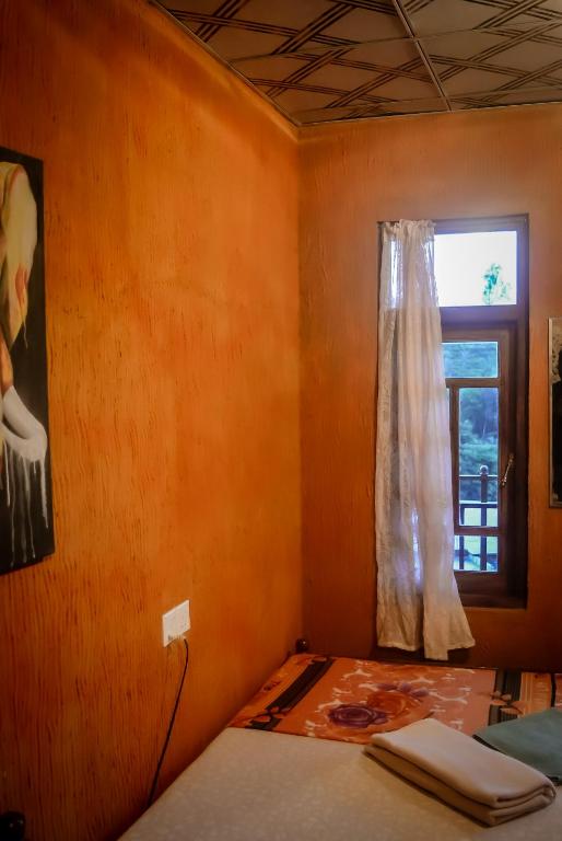 Postel nebo postele na pokoji v ubytování Hostal Tree House