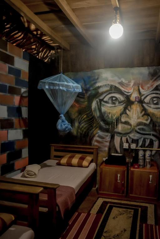 Postel nebo postele na pokoji v ubytování Hostal Tree House
