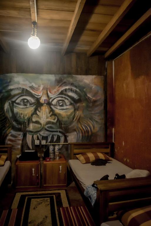 Postel nebo postele na pokoji v ubytování Hostal Tree House