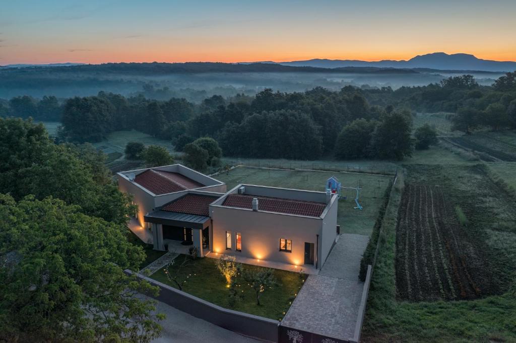 an aerial view of a house with lights on at Residence Villa Manuela - Batlug in Batlug