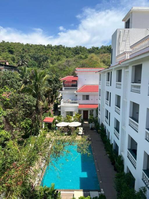 an aerial view of a hotel with a swimming pool at 1Bed Field View Penthouse in Assagao by Masaya stays in Bardez