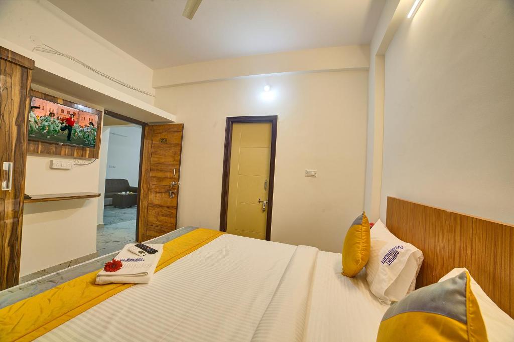 Postel nebo postele na pokoji v ubytování Hotel Airport Southgate Bangalore
