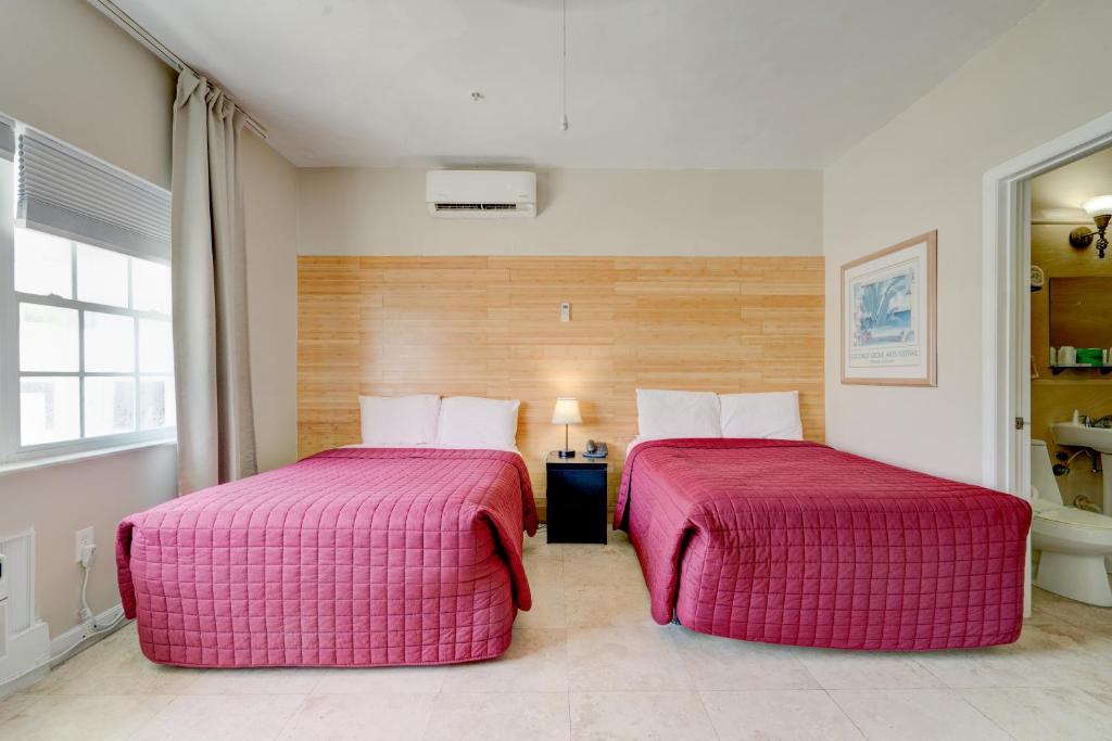 Postel nebo postele na pokoji v ubytování James Hotel