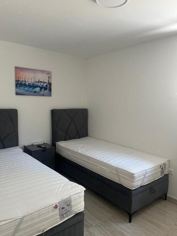 Postel nebo postele na pokoji v ubytování Apartmani Vision Mandre