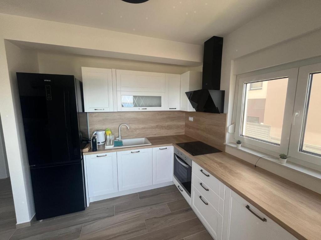 Kuchyň nebo kuchyňský kout v ubytování Apartmani Vision Mandre