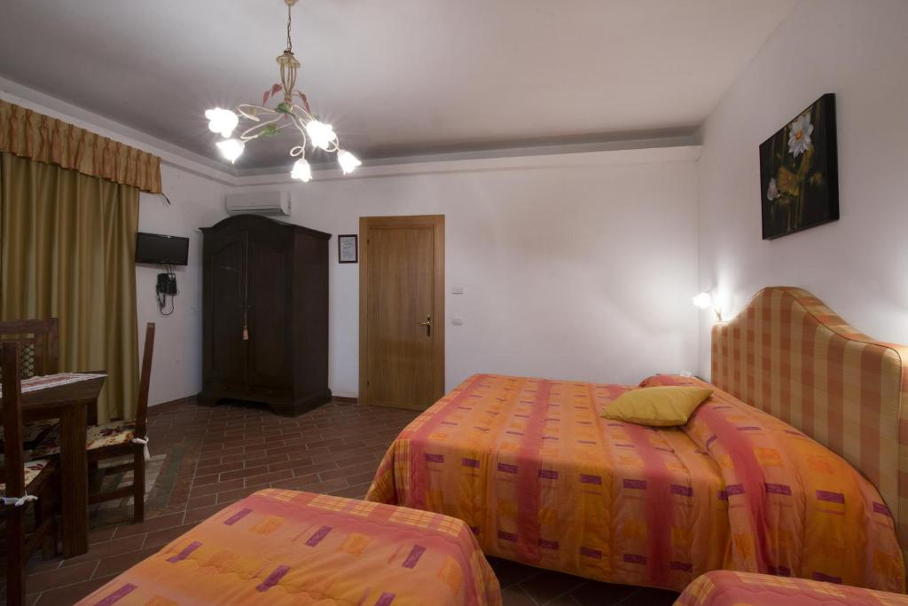 Postel nebo postele na pokoji v ubytování Cecco di Nara