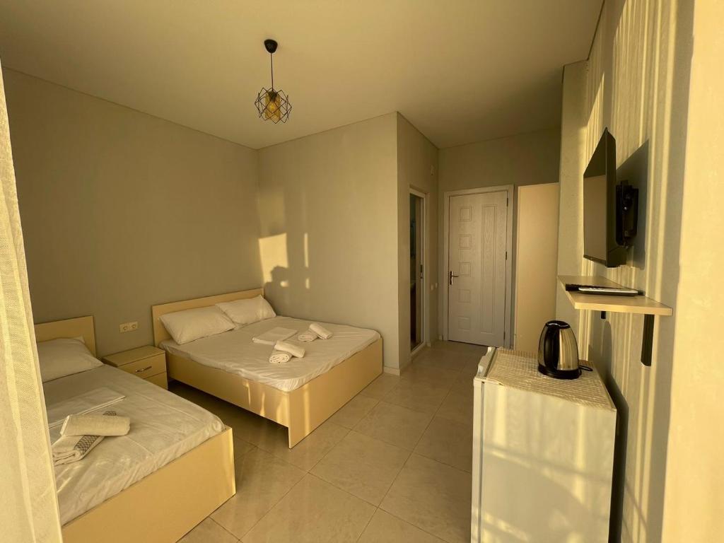 Postel nebo postele na pokoji v ubytování Hotel Nikolas