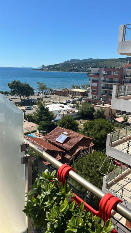 a view of the ocean from the balcony of a building at Sun Holiday Apartment in Lezhë