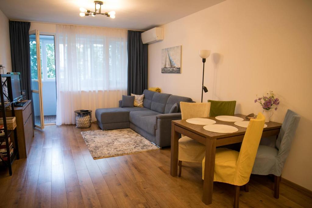 a living room with a couch and a table at VARNA SEA VIEW Apartment in Varna City