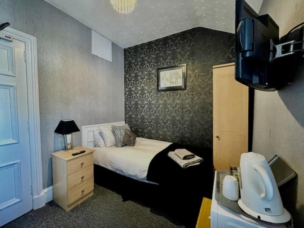 Postel nebo postele na pokoji v ubytování Vaila Guest House