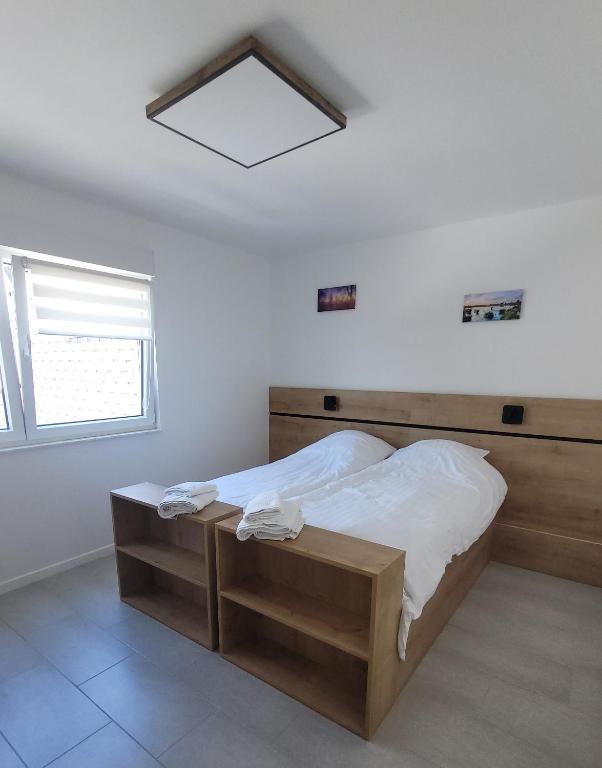 Postel nebo postele na pokoji v ubytování Aparthouse HAAS41 - Eupen