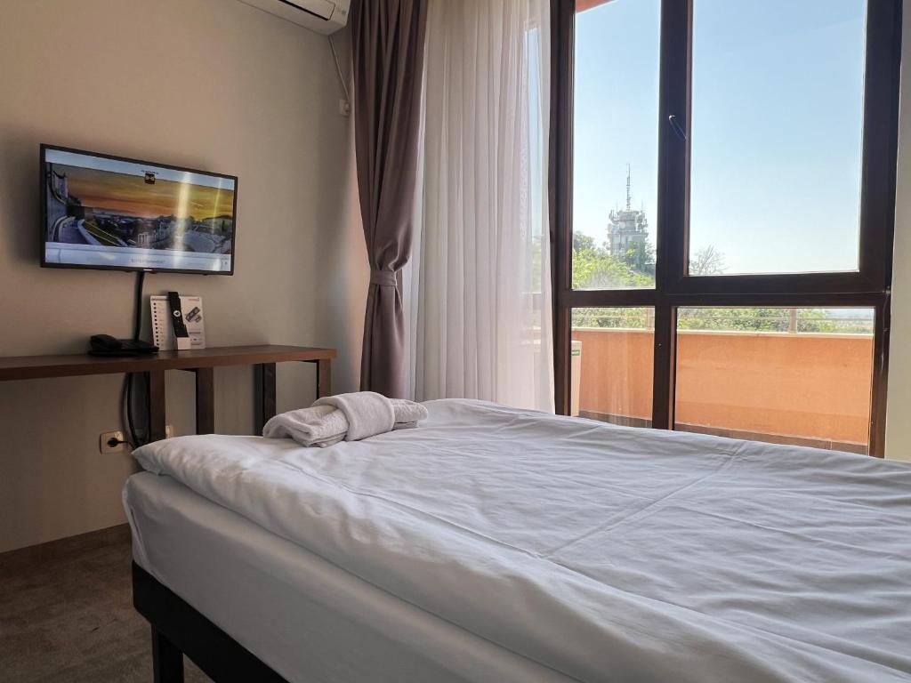 Postel nebo postele na pokoji v ubytování Clepsydra Residence