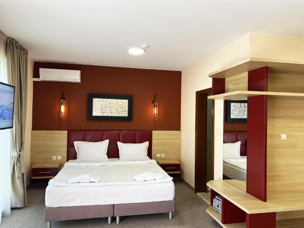 Postel nebo postele na pokoji v ubytování Clepsydra Residence