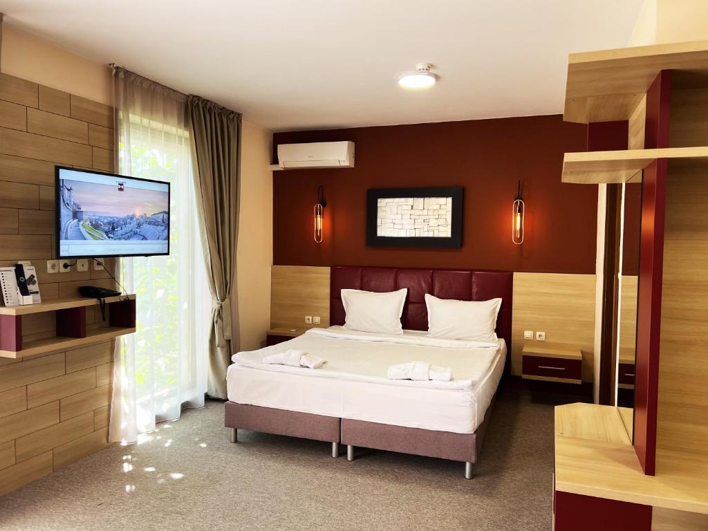 Postel nebo postele na pokoji v ubytování Clepsydra Residence