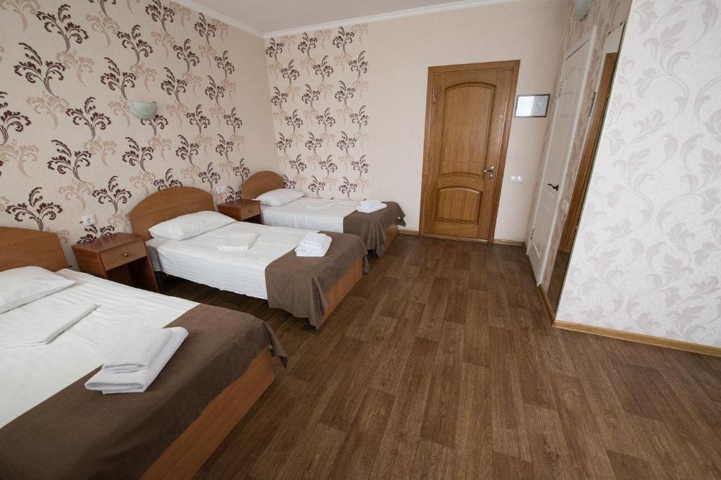 Postel nebo postele na pokoji v ubytování Hotel LaMa 2