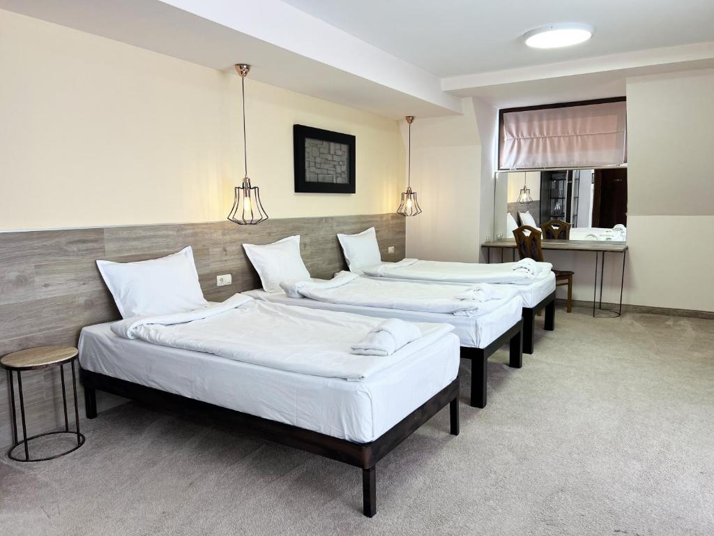 Postel nebo postele na pokoji v ubytování Clepsydra Residence