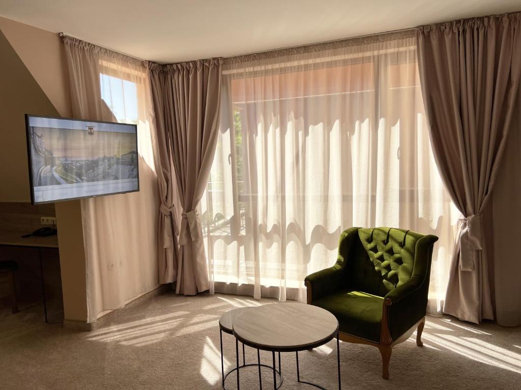 TV a/nebo společenská místnost v ubytování Clepsydra Residence