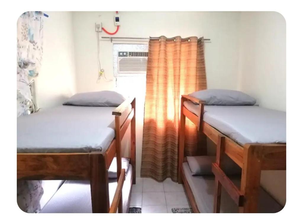 SM City Area Backpacker’s Place with Aircon & WIFI - Housity